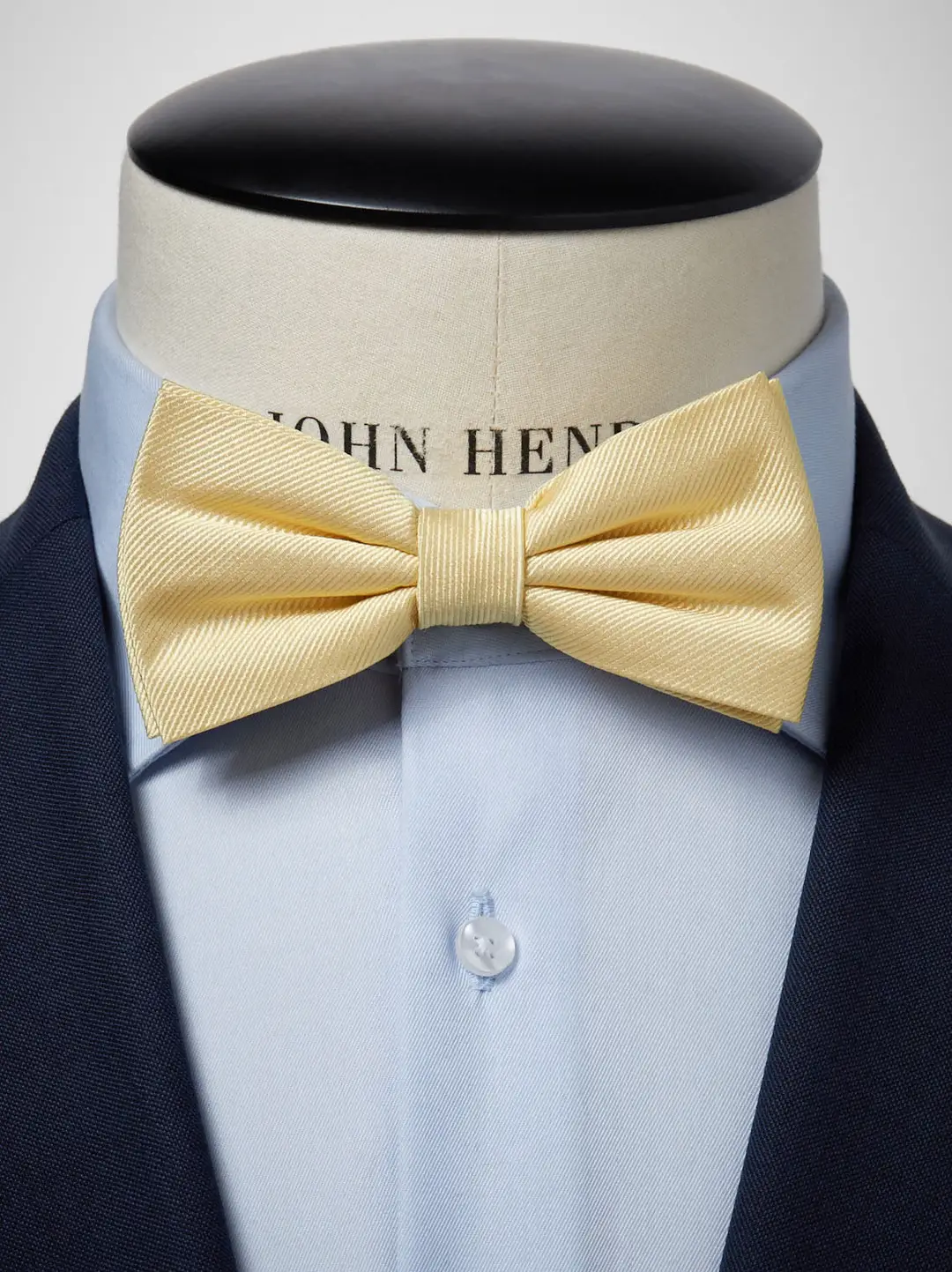 White shirt yellow bow tie top