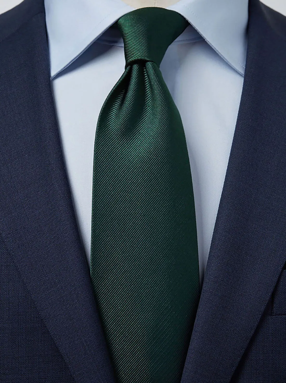 blue shirt and green tie