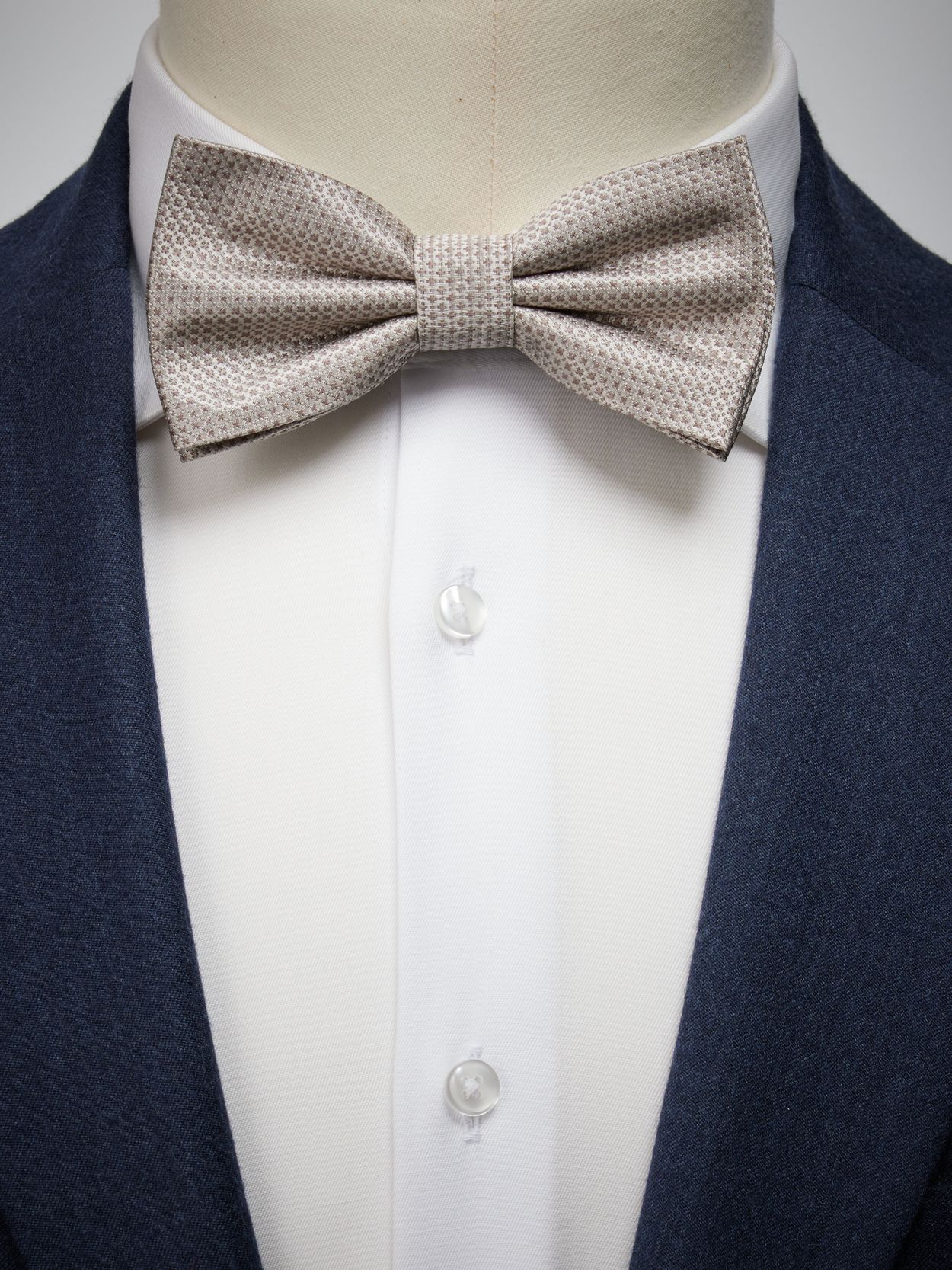 Beige Bow Tie Structure