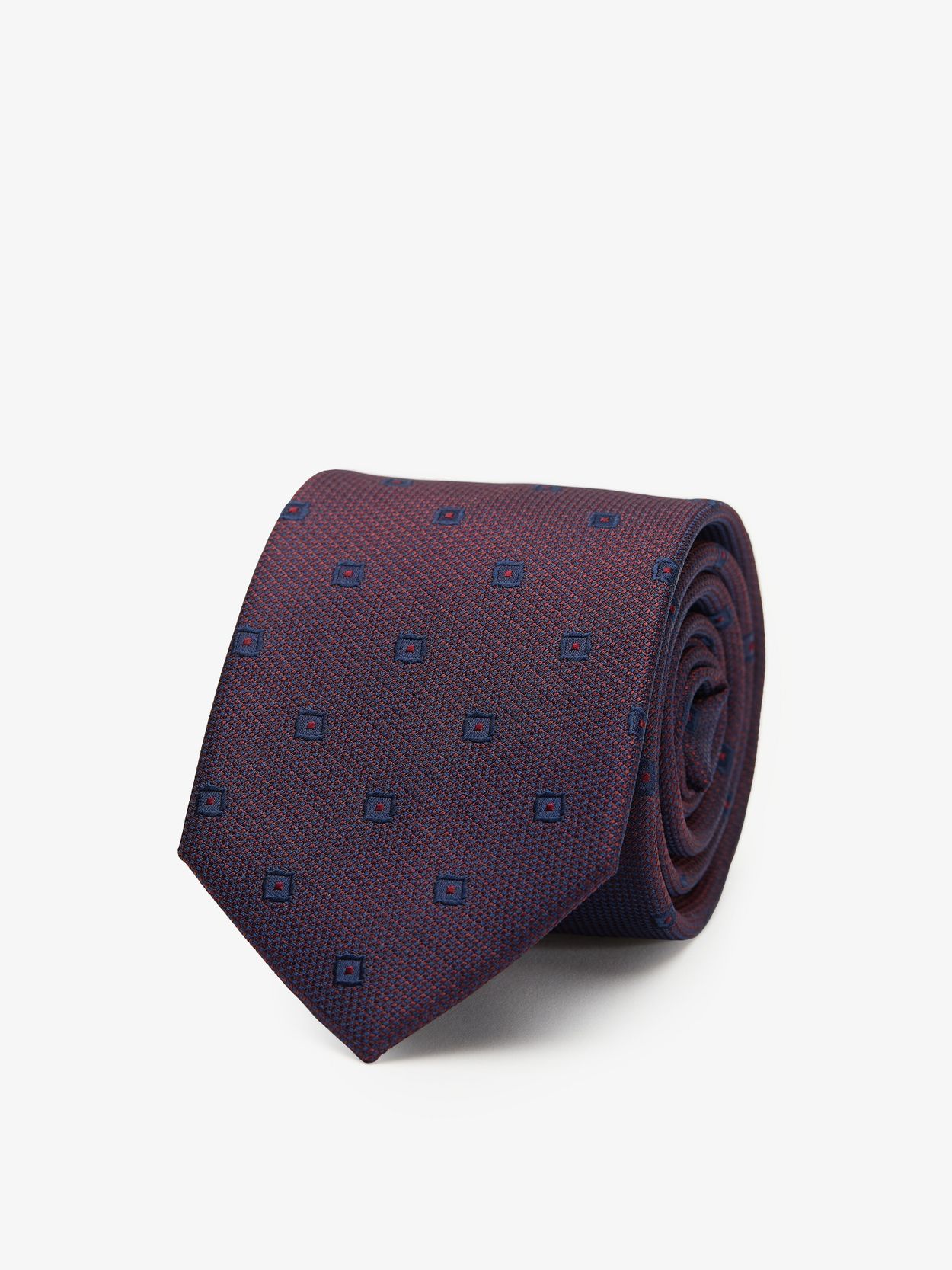 burgundy tie meaning