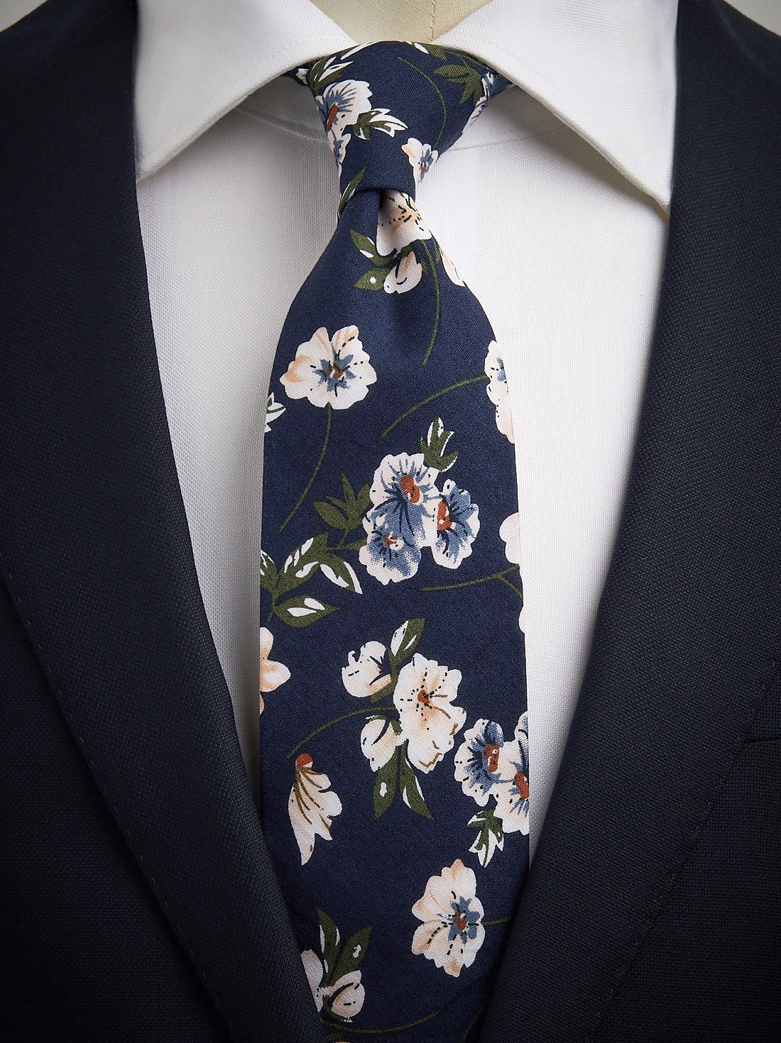 Make a Statement with a Navy Blue Suit and Stunning Floral Tie Click